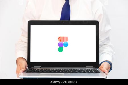 Figma for designing user interface on computer, editorial background with person showing on laptop Stock Photo