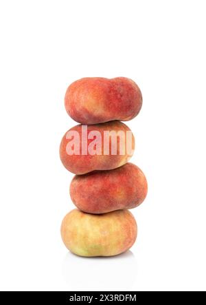 four peaches stacked nectarines plum fruit isolated on white background. clipping path included. Stock Photo