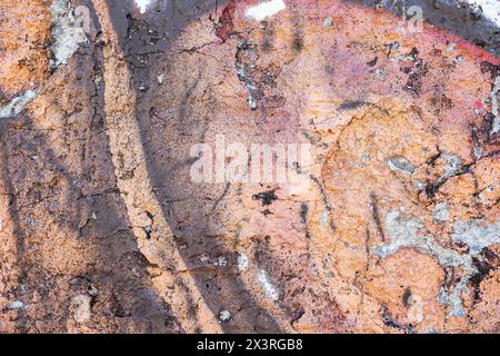 Brown and orange wall with chipped painted concrete wall texture. Stock Photo