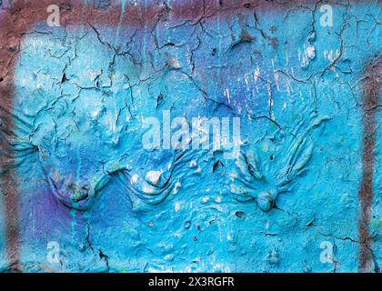 An old cracked wall painted cyan blue with three large drips. Stock Photo