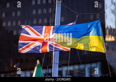 British and Ukraining flags flying on a boat in Liverpool Stock Photo