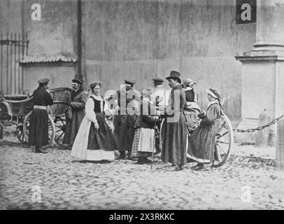 Warsaw, Poland (group of unidentified people standing in the street) Karol Adolf Beyer Polish, Albumen silver print black and white 1865 - 1875 Stock Photo