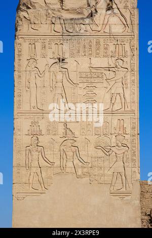 Hathor, Sobek and Heru-ur (Horus the Elder) receiving offerings on a relief at the Temple of Kom Ombo, Egypt Stock Photo