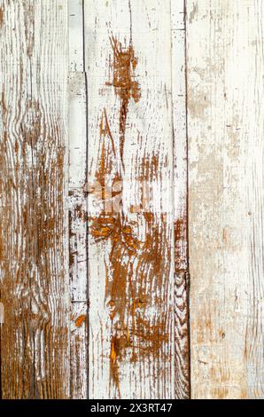 white painted wooden door weathered by time, textured background Stock Photo