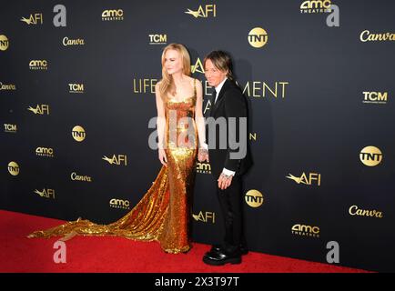 HOLLYWOOD, CALIFORNIA - APRIL 27: (L-R) Nicole Kidman and Keith Urban attend the 49th AFI Lifetime Achievement Award Gala Tribute celebrating Nicole K Stock Photo
