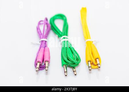Multicolor cable isolated on white background, clipping path included. Mini Stereo Jack to Jack Plug Audio Cables Stock Photo