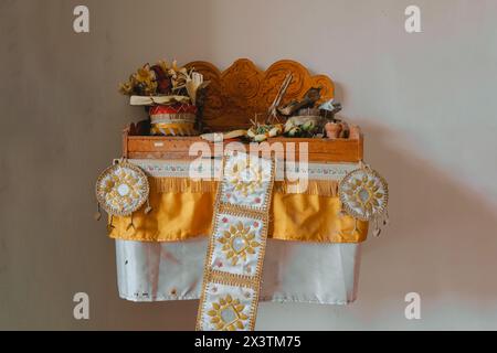 Sacred wooden board used for worship by Balinese Hindu people called Pelangkiran that usually stored in the corner of the room Stock Photo