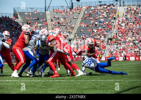 USA. 28th Apr, 2024. D.C. Defenders' running back Cam'ron Harris is tripped up by St. Louis Battlehawks' cornerback Brandon Sebastian during their game at Audi Field, April 28, 2024. The Battlehawks defeated the Defenders 45-12. (Photo by Zach Brien/Sipa USA) Credit: Sipa USA/Alamy Live News Stock Photo