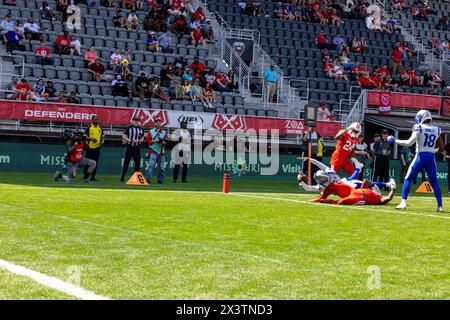 USA. 28th Apr, 2024. St. Louis Battlehawks quarterback Manny Wilkins runs for a touchdown off a read option during their road game against the D.C. Defenders in Audi Field, April 28, 2024. The Battlehawks defeated the Defenders 45-12. (Photo by Zach Brien/Sipa USA) Credit: Sipa USA/Alamy Live News Stock Photo