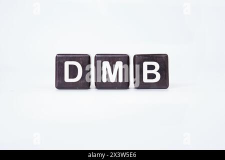 DMB text on cubes on a white background. Stock Photo