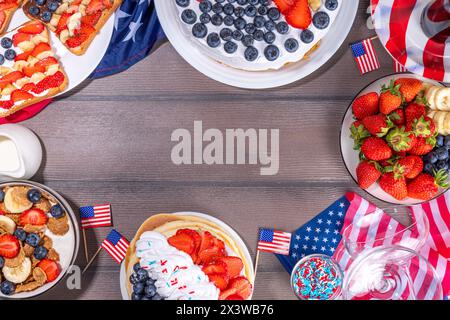 Fourth of July, Patriotic Independence day desserts.  4th of July sweet brunch food and snacks - toast sandwiches, flakes with berries, cake, pancakes Stock Photo
