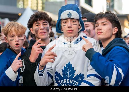 April 24, 2024, Toronto, Ontario, Canada: Fans gather at Maple Leaf Square outside Scotibank Arena, watching Round 1, Game 4 playoff game of Toronto Maple Leafs vs Boston Bruins playoff game on a giant screen. During Toronto Maple Leafs playoff games, Maple Leaf Square transforms into a sea of blue and white, echoing with the chants of passionate fans eagerly rallying behind their team's quest for victory. The electric atmosphere radiates anticipation and excitement, creating unforgettable memories for both die-hard supporters and casual observers alike. (Credit Image: © Shawn Goldberg/SOPA Im Stock Photo