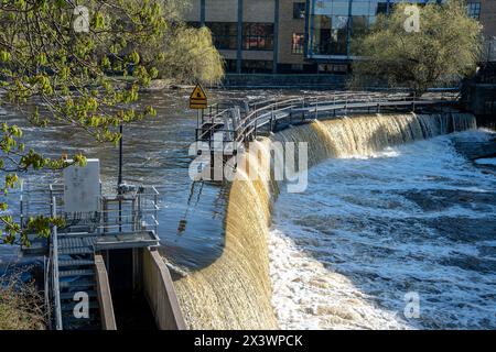 Motala Stream in the industrial landscape of Norrköping during spring in Sweden. Norrköping is a historic industrial town. Stock Photo