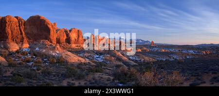 Direct sunlight brings life to the Garden of Eden in Arches National Park, Utah on December 26, 2006. The snowcapped La Sal mountains in the backgroun Stock Photo