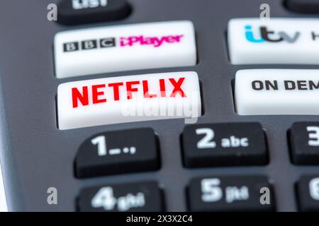 Close-Up Of a Freesat Remote Control which has buttons for Netflix, BBC iPlayer, itv Hub and On Demand Stock Photo