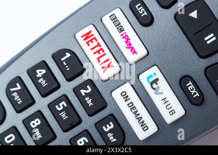 Close-Up Of a Freesat Remote Control which has buttons for Netflix, BBC iPlayer, itv Hub and On Demand Stock Photo