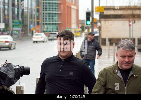 Belfast, United Kingdom 29 04 2024 Jordan Gareth Devine pictured wearing a black polo shirt entering Laganside court to face murder charge for the killing of journalist Lyra McKee in Derry. Visible police presence outside the court today(Monday 29th April 2024) Belfast Northern Ireland Credit: HeadlineX/Alamy Live News Stock Photo