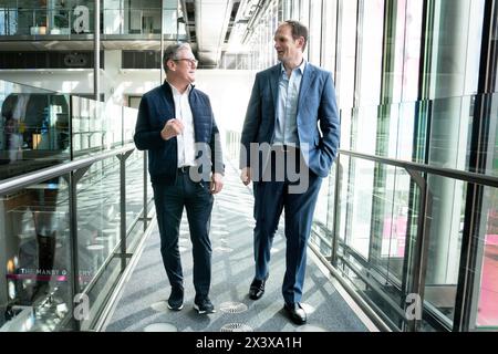 Labour Party leader Sir Keir Starmer welcomes MP and psychiatrist Dr Dan Poulter to the Labour Party at The Francis Crick Institute in London. The MP for Central Suffolk and North Ipswich quit the Tory Party in anger over the NHS crisis. Picture date: Monday April 29, 2024. Stock Photo