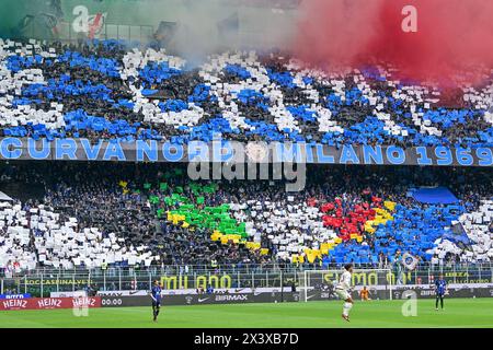 Milano, Italy. 28th Apr, 2024. Football fans of Inter seen on the stands with a tifo during the Serie A match between Inter and Torino at Giuseppe Meazza in Milano. (Photo Credit: Gonzales Photo/Alamy Live News Stock Photo