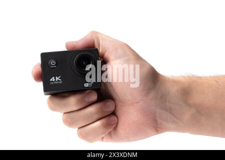 Man hand holding an action camera is highlighted on a white background Stock Photo