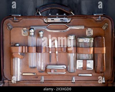 Retro suitcase with medical bottles Stock Photo