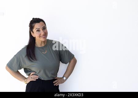 Portrait of confident entrepreneurial mother on white background Stock Photo