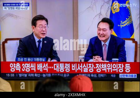 South Korea's 24-hour Yonhapnews TV shows South Korean President Yoon Suk Yeol (R) meeting with main opposition Democratic Party leader Lee Jae-myung (L) during a news program at the Seoul Railway Station in Seoul. Opposition leader Lee Jae-Myung asked President Yoon Suk Yeol on April 29 to agree to a special probe into suspicions surrounding a Marine's death and to resolve suspicions surrounding his family in an apparent reference to first lady Kim Keon Hee. Opposition leader Lee made the demands during his first-ever meeting with President Yoon at the presidential office, which followed the Stock Photo