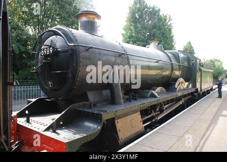 Modified Hall class steam locomotive Wightwick Hall at East Grinstead station on the heritage Bluebell Railway  in West Sussex, England on August 24, 2023. The engine was built in 1948 at Swindon. Stock Photo
