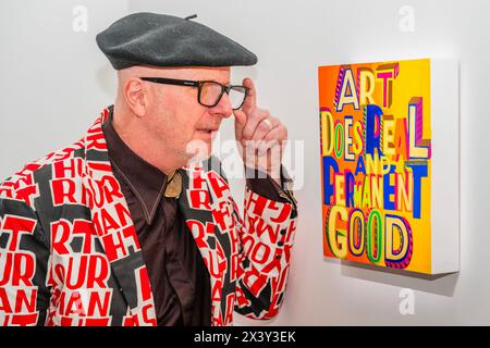 London, UK. 29th Apr, 2024. Bob and Roberta Smith (pictured), with Art does real and permanent good, 2022 - A preview of 'Art for AT THE BUS', which offers school-based art as therapy on a double decker bus to support the well-being of young people. The sale includes over 30 works and is to be exhibited at Sotheby's New Bond Street gallery from 29 April to 7 May 2024. The works will be sold via online auction, powered by Artsy, from 29 April till 5pm on 10 May 2024 with the proceeds going to AT The Bus. Credit: Guy Bell/Alamy Live News Stock Photo