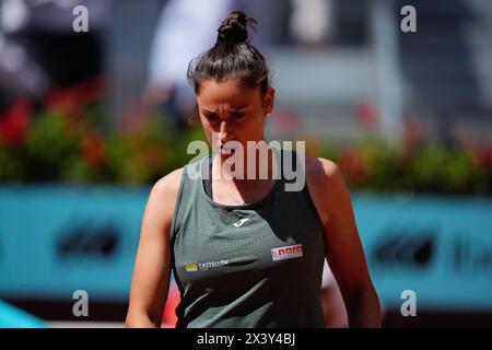 Madrid, Spain. 29th Apr, 2024. Sara Sorribes of Spain in action against Iga Swiatek of Poland during the Mutua Madrid Open 2024, ATP Masters 1000 and WTA 1000, tennis tournament on April 29, 2024 at Caja Magica in Madrid, Spain Credit: Independent Photo Agency/Alamy Live News Stock Photo