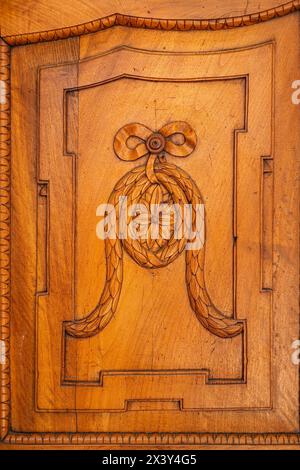 Details of carvings on a rustic front door in the historic Old Town of Bolzano, South Tyrol, Italy. Stock Photo