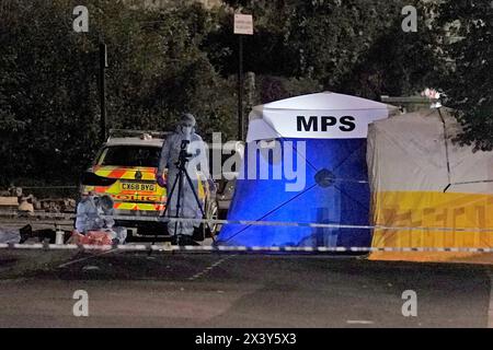 File photo dated 16/08/22 of forensic officers at the scene near to Cayton Road, Greenford, in west London, where Thomas O'Halloran was stabbed to death whilst riding his mobility scooter. Lee Byer has pleaded guilty at the Old Bailey to his manslaughter, he stabbed the 87-year-old in the neck and chest in August 2022. Issue date: Monday April 29, 2024. Stock Photo