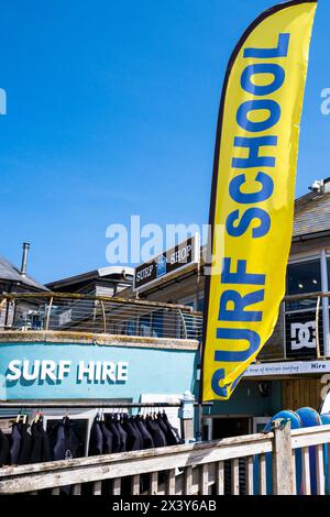 A banner advertising a surf school at Fistral in Newquay in Cornwall in the UK. Stock Photo