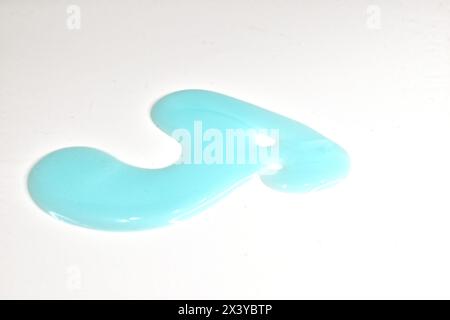 Green shampoo was smeared on the surface of the table. Stock Photo