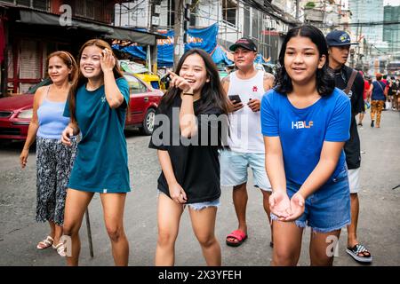 Filipino children play street games together during an annual religious celebration and festival in the Tondo district. Stock Photo