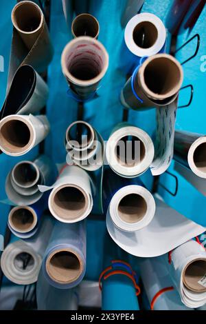 Overhead view of organized blueprints in a creative workspace. Stock Photo