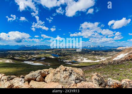 Plateau in the Beartooth Mountains under a partly cloudy blue sky Stock Photo