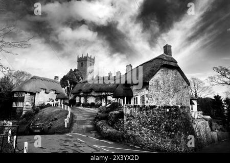 All Saints Church on the hill overlooks the quintessential English village of Godshill, a popilar tourist destination on the Isle of Wight. Stock Photo