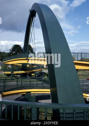 Detail of pedestrian footbridge over A48 at Coedkernew, framing LG building nearby, more recently sold to Microsoft. Stock Photo