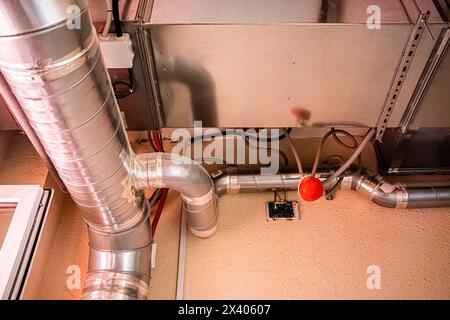 Ventilation pipes in building. Heating and cooling distribution ducts. Poor construction, violation of standards. Stock Photo