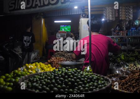 Bandung, West Java, Indonesia. 29th Apr, 2024. Indonesian football fans watch together the 2024 AFC Qatar U23 Asian Cup semifinal football match between Indonesia and Uzbekistan on the streets of Bandung. (Credit Image: © Dimas Rachmatsyah/ZUMA Press Wire) EDITORIAL USAGE ONLY! Not for Commercial USAGE! Stock Photo