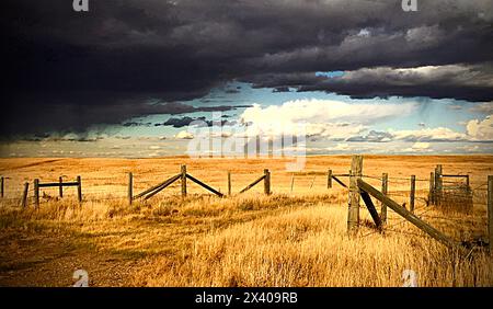 dark prairie storm clouds over field Stock Photo