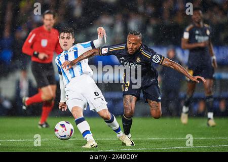 Eder Militao of Real Madrid CF compete for the ball with Ander Barrenetxea of Real Sociedad during the LaLiga EA Sports match between Real Sociedad an Stock Photo