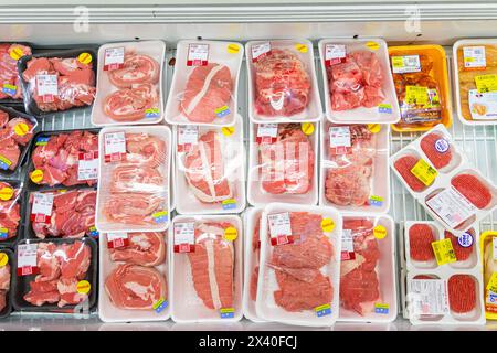 Products in a supermarket shelf. Packaged meat Stock Photo