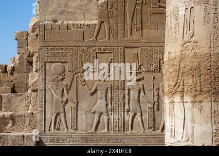 Sobek, the crocodile god, receiving an offering on a bas relief in the Temple of Kom Ombo, Egypt Stock Photo