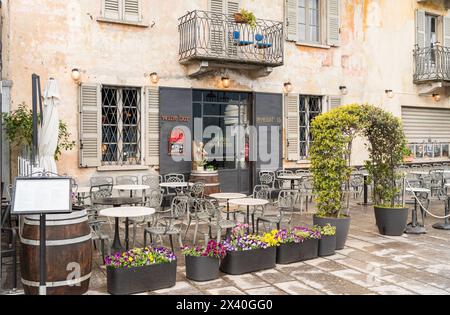 Cannobio, Piedmont, Italy - April 26, 2024: Characteristic wine bar in the historic center of Cannobio, the popular holiday resort on the shore of Lak Stock Photo