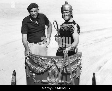 Famous stunt man YAKIMA CANUTT instructs STEPHEN BOYD how to drive a chariot during the making of BEN HUR 1959 Director WILLIAM WYLER  Music MIKLOS ROZSA Costume Design ELIZABETH HAFFENDEN Metro Goldwyn Mayer Stock Photo