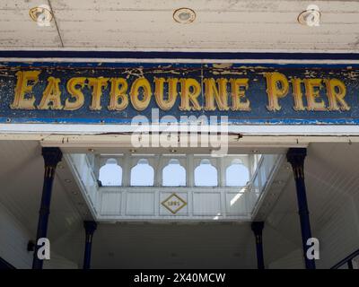 Eastbourne Pier entrance with details of the painted sign, colonnade and balcony; Eastbourne, East Sussex, England Stock Photo