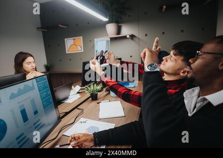 Colleagues taking a fun selfie during a break in a modern office environment Stock Photo