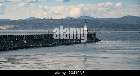 Ogden Point Breakwater Lighthouse. Ogden Point is a deep water port facility located in the southwestern corner of the city of Victoria, BC Stock Photo